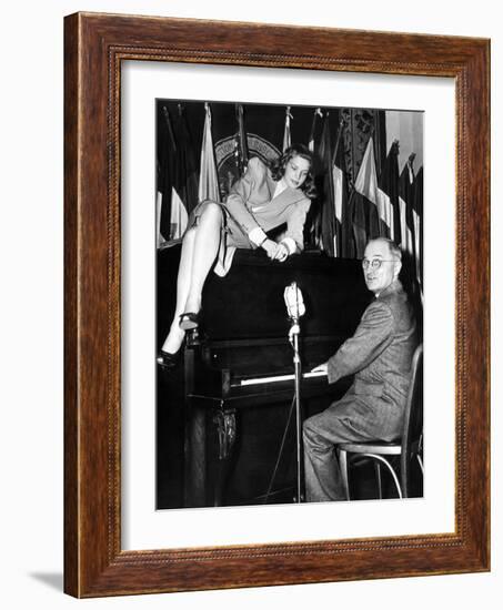 Actress Lauren Bacall Sits Atop the Piano While Vice President Harry Truman Plays-null-Framed Photo