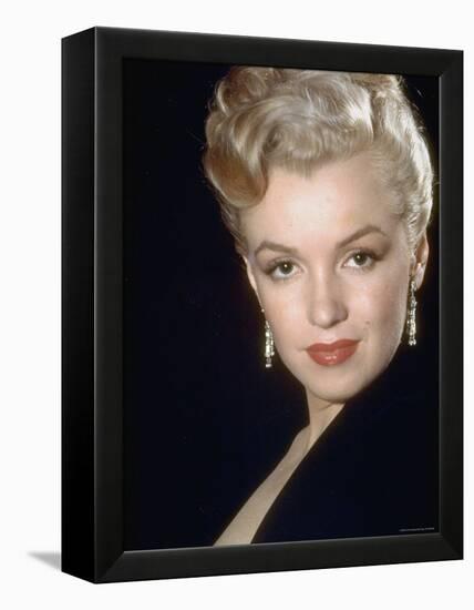 Actress Marilyn Monroe Wearing Dangling Rhinestone Earrings, with Her Hair Up-Ed Clark-Framed Premier Image Canvas