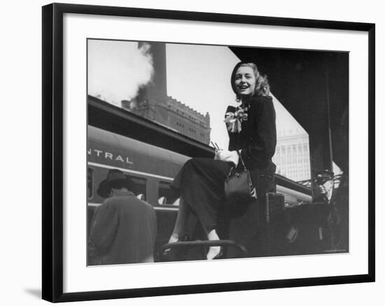 Actress Patricia Neal Sitting on Her Luggage on the Platform of a Train Station During a Stopover-Ed Clark-Framed Premium Photographic Print