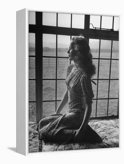 Actress Peggy Cummins Looking Out of a Window-Bob Landry-Framed Premier Image Canvas