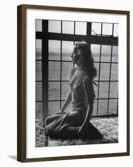 Actress Peggy Cummins Looking Out of a Window-Bob Landry-Framed Premium Photographic Print