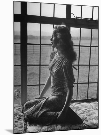 Actress Peggy Cummins Looking Out of a Window-Bob Landry-Mounted Premium Photographic Print