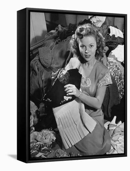Actress Shirley Temple, Gathering Her Unwanted Clothes Together to Donate to a Clothing Drive-Martha Holmes-Framed Premier Image Canvas