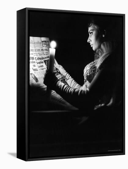 Actress Sophia Loren Reading Newspaper by Candlelight While in Costume for "Madame Sans Gene"-Alfred Eisenstaedt-Framed Premier Image Canvas