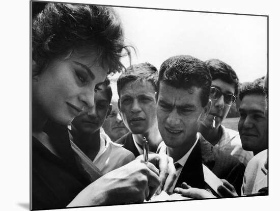 Actress Sophia Loren Signing Autographs for Fans During Location Filming of "Madame Sans Gene"-Alfred Eisenstaedt-Mounted Premium Photographic Print