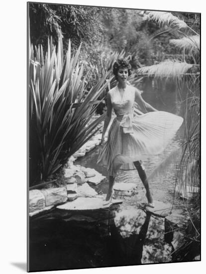 Actress Sophia Loren Walking Through Grounds of Hotel-null-Mounted Premium Photographic Print