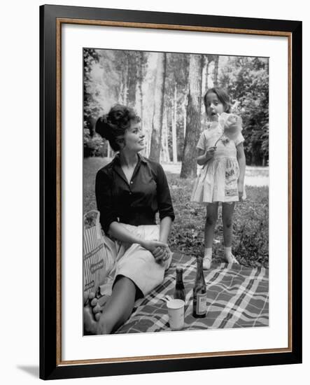 Actress Sophia Loren with Girl Holding a Flower During Picnic While Filming "Madame Sans Gene"-Alfred Eisenstaedt-Framed Premium Photographic Print