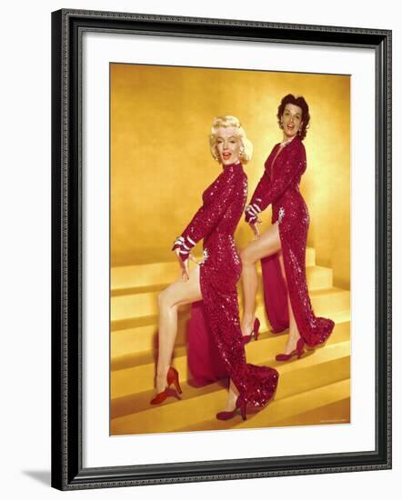 Actresses Marilyn Monroe and Jane Russell Wearing Gowns Designed by Travilla Pose for Publicity-Ed Clark-Framed Premium Photographic Print