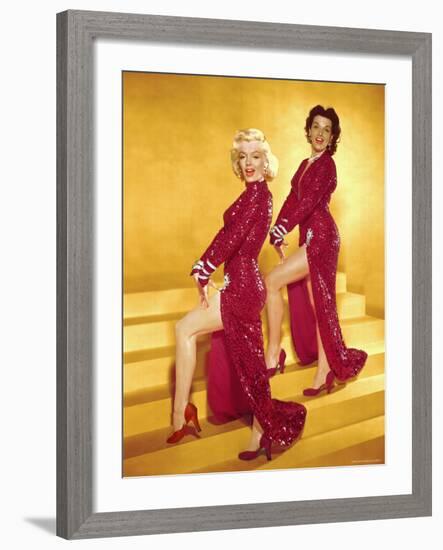 Actresses Marilyn Monroe and Jane Russell Wearing Gowns Designed by Travilla Pose for Publicity-Ed Clark-Framed Premium Photographic Print