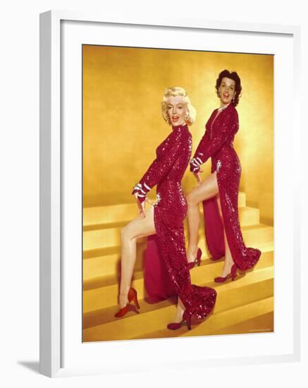 Actresses Marilyn Monroe and Jane Russell Wearing Gowns Designed by Travilla Pose for Publicity-Ed Clark-Framed Premium Photographic Print