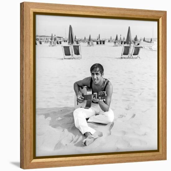 Adriano Celentano with the Guitar at the Beach-Marisa Rastellini-Framed Premier Image Canvas