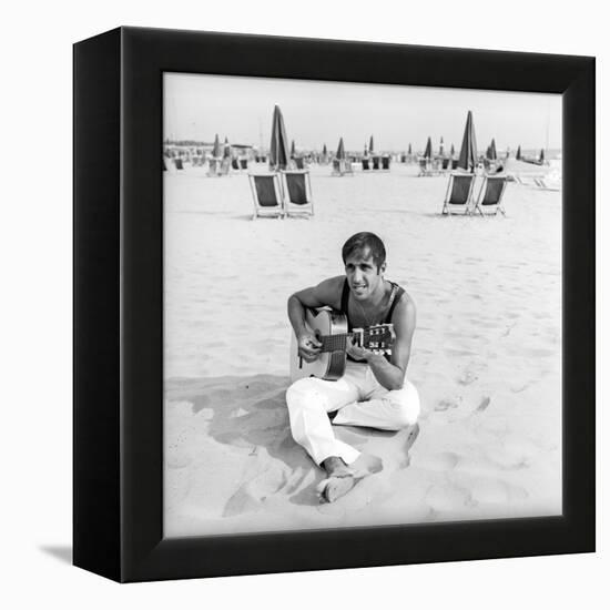 Adriano Celentano with the Guitar at the Beach-Marisa Rastellini-Framed Premier Image Canvas