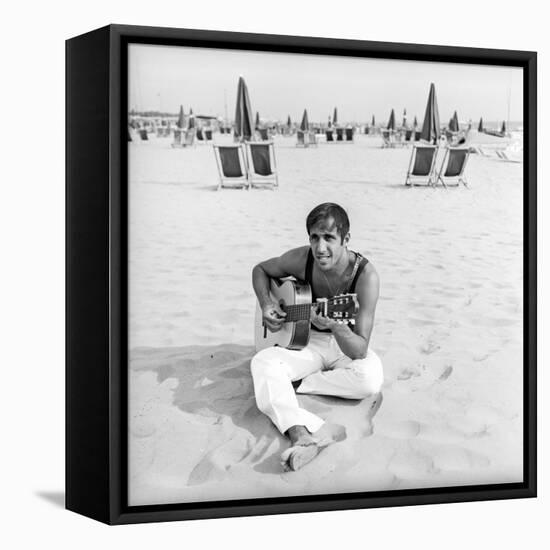 Adriano Celentano with the Guitar at the Beach-Marisa Rastellini-Framed Premier Image Canvas