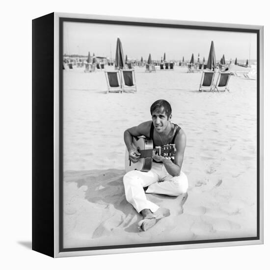 Adriano Celentano with the Guitar at the Beach-Marisa Rastellini-Framed Premier Image Canvas