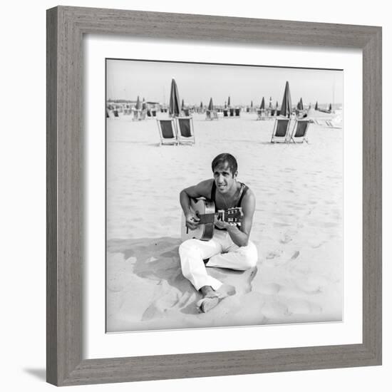 Adriano Celentano with the Guitar at the Beach-Marisa Rastellini-Framed Photographic Print