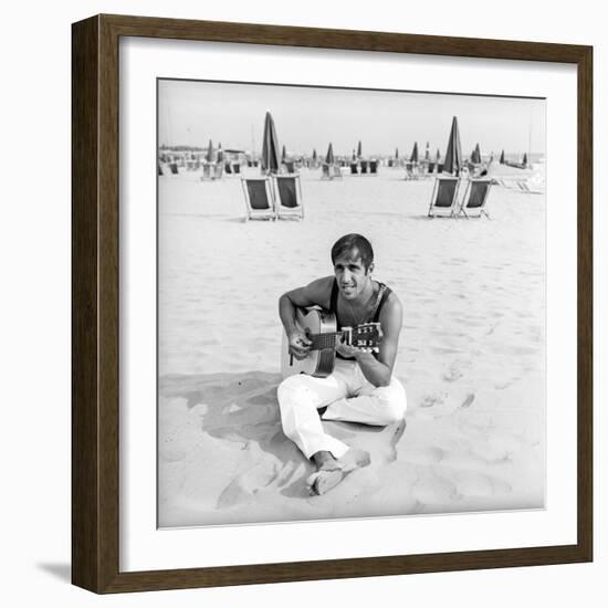 Adriano Celentano with the Guitar at the Beach-Marisa Rastellini-Framed Photographic Print