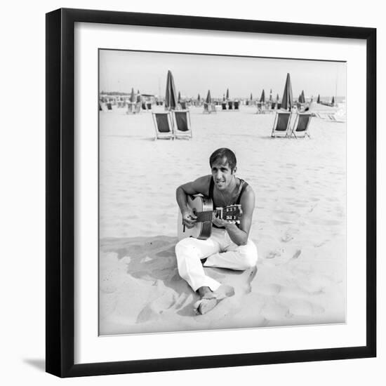 Adriano Celentano with the Guitar at the Beach-Marisa Rastellini-Framed Photographic Print