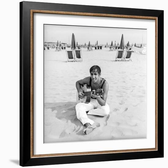 Adriano Celentano with the Guitar at the Beach-Marisa Rastellini-Framed Photographic Print