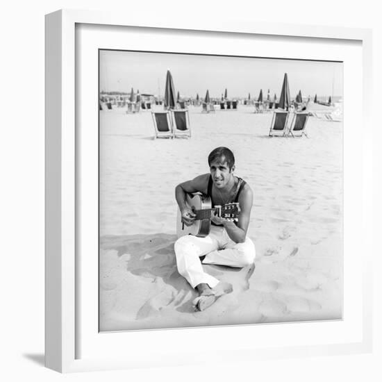 Adriano Celentano with the Guitar at the Beach-Marisa Rastellini-Framed Photographic Print