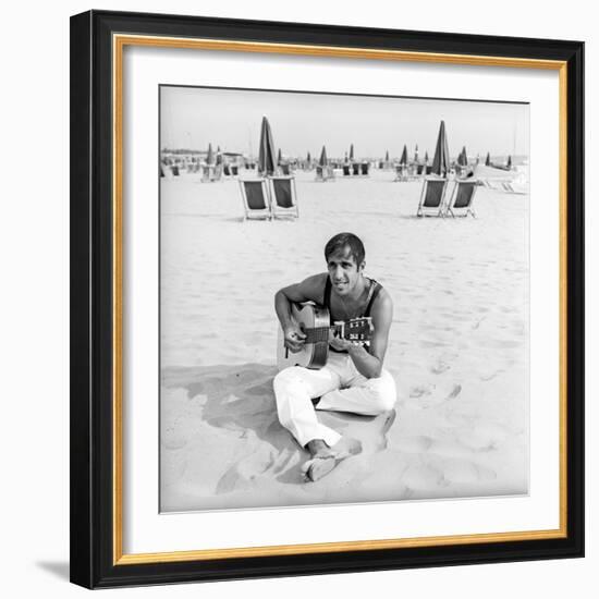 Adriano Celentano with the Guitar at the Beach-Marisa Rastellini-Framed Photographic Print