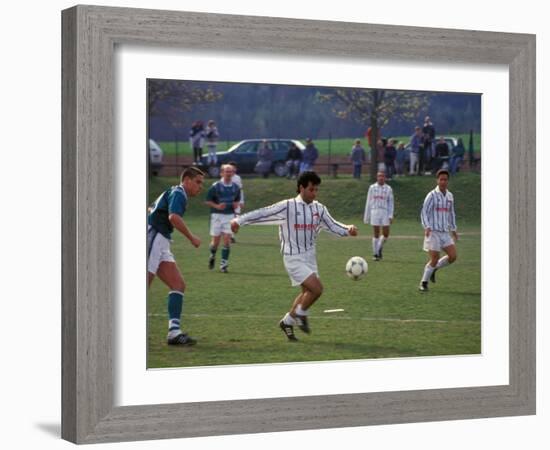 Adults playing soccer, Germany-Alan Klehr-Framed Photographic Print