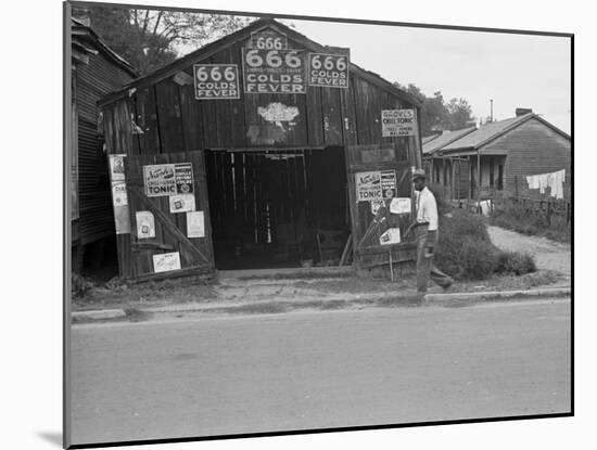 Advertisements for Popular Malaria Cure, Natchez, Mississippi, c.1935-Ben Shahn-Mounted Photo