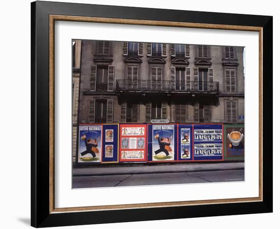 Advertising Posters Plastered on a Wall Along the Rue de Courcelles-William Vandivert-Framed Photographic Print