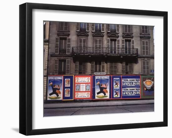 Advertising Posters Plastered on a Wall Along the Rue de Courcelles-William Vandivert-Framed Photographic Print