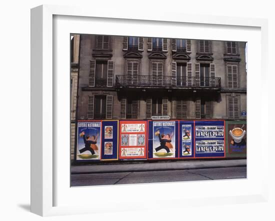 Advertising Posters Plastered on a Wall Along the Rue de Courcelles-William Vandivert-Framed Photographic Print