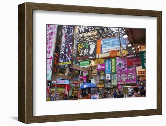 Advertising signs on a busy street in the popular shopping area of Mong Kok (Mongkok), Kowloon, Hon-Fraser Hall-Framed Photographic Print