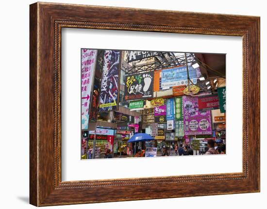 Advertising signs on a busy street in the popular shopping area of Mong Kok (Mongkok), Kowloon, Hon-Fraser Hall-Framed Photographic Print