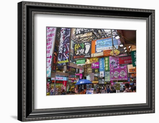 Advertising signs on a busy street in the popular shopping area of Mong Kok (Mongkok), Kowloon, Hon-Fraser Hall-Framed Photographic Print