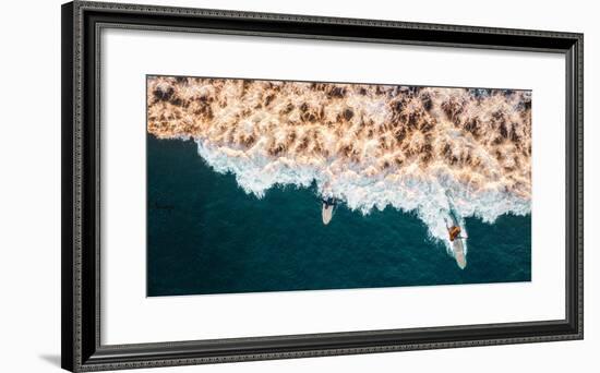 Aerial drone photo of surfers riding Pacific Ocean waves in San Diego, California at Sunset Cliffs-David Chang-Framed Photographic Print