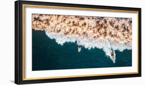 Aerial drone photo of surfers riding Pacific Ocean waves in San Diego, California at Sunset Cliffs-David Chang-Framed Photographic Print