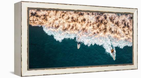 Aerial drone photo of surfers riding Pacific Ocean waves in San Diego, California at Sunset Cliffs-David Chang-Framed Premier Image Canvas
