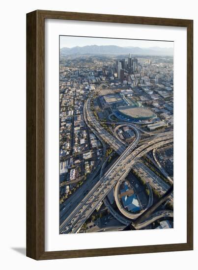 Aerial of Los Angeles with a Freeway Interchange in the Foreground and Downtown Usa-Natalie Tepper-Framed Photo