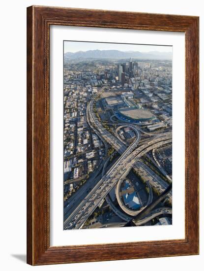 Aerial of Los Angeles with a Freeway Interchange in the Foreground and Downtown Usa-Natalie Tepper-Framed Photo