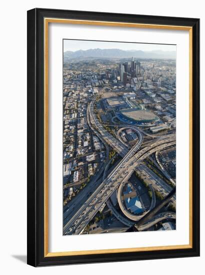 Aerial of Los Angeles with a Freeway Interchange in the Foreground and Downtown Usa-Natalie Tepper-Framed Photo