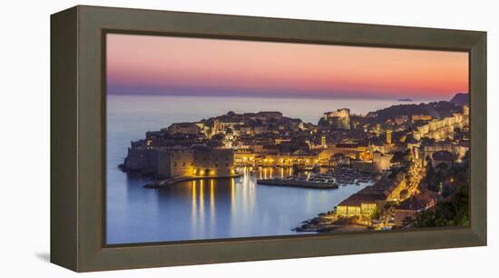 Aerial panorama of Dubrovnik Old Town at night with orange sunset sky, UNESCO World Heritage Site, -Neale Clark-Framed Premier Image Canvas