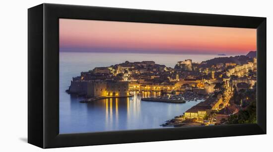 Aerial panorama of Dubrovnik Old Town at night with orange sunset sky, UNESCO World Heritage Site, -Neale Clark-Framed Premier Image Canvas