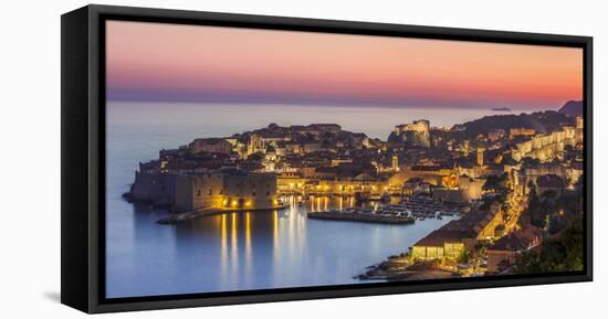 Aerial panorama of Dubrovnik Old Town at night with orange sunset sky, UNESCO World Heritage Site, -Neale Clark-Framed Premier Image Canvas