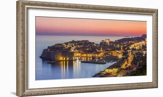 Aerial panorama of Dubrovnik Old Town at night with orange sunset sky, UNESCO World Heritage Site, -Neale Clark-Framed Photographic Print