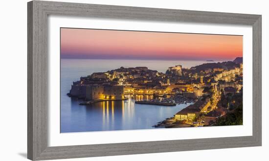 Aerial panorama of Dubrovnik Old Town at night with orange sunset sky, UNESCO World Heritage Site, -Neale Clark-Framed Photographic Print