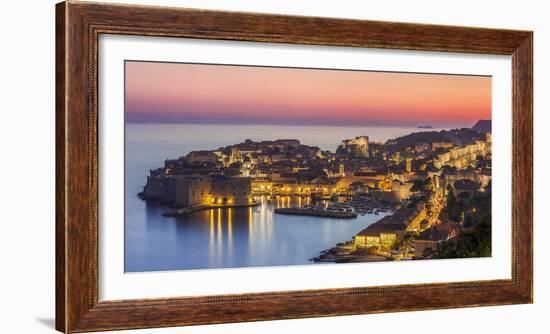 Aerial panorama of Dubrovnik Old Town at night with orange sunset sky, UNESCO World Heritage Site, -Neale Clark-Framed Photographic Print