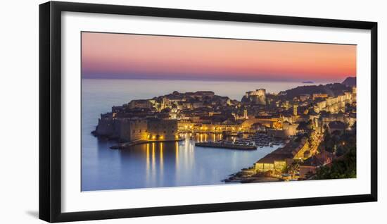 Aerial panorama of Dubrovnik Old Town at night with orange sunset sky, UNESCO World Heritage Site, -Neale Clark-Framed Photographic Print