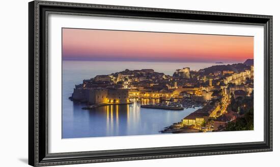 Aerial panorama of Dubrovnik Old Town at night with orange sunset sky, UNESCO World Heritage Site, -Neale Clark-Framed Photographic Print