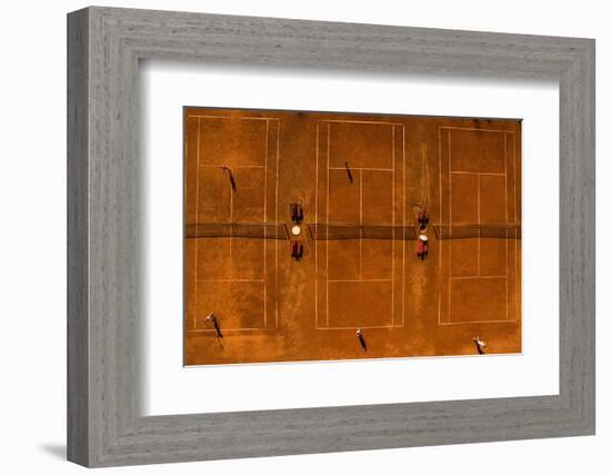 Aerial Shot of a Tennis Courts with Players in Warm Evening Sunlight-l i g h t p o e t-Framed Photographic Print