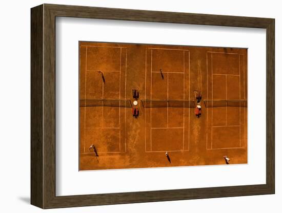 Aerial Shot of a Tennis Courts with Players in Warm Evening Sunlight-l i g h t p o e t-Framed Photographic Print