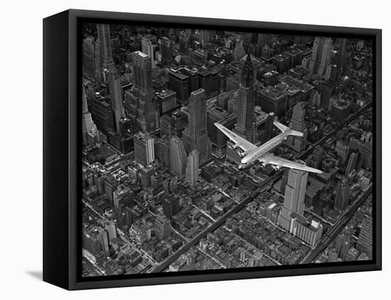 Aerial View of a DC-4 Passenger Plane Flying over Midtown Manhattan-Margaret Bourke-White-Framed Premier Image Canvas