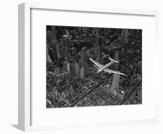 Aerial View of a DC-4 Passenger Plane Flying over Midtown Manhattan-Margaret Bourke-White-Framed Premium Photographic Print